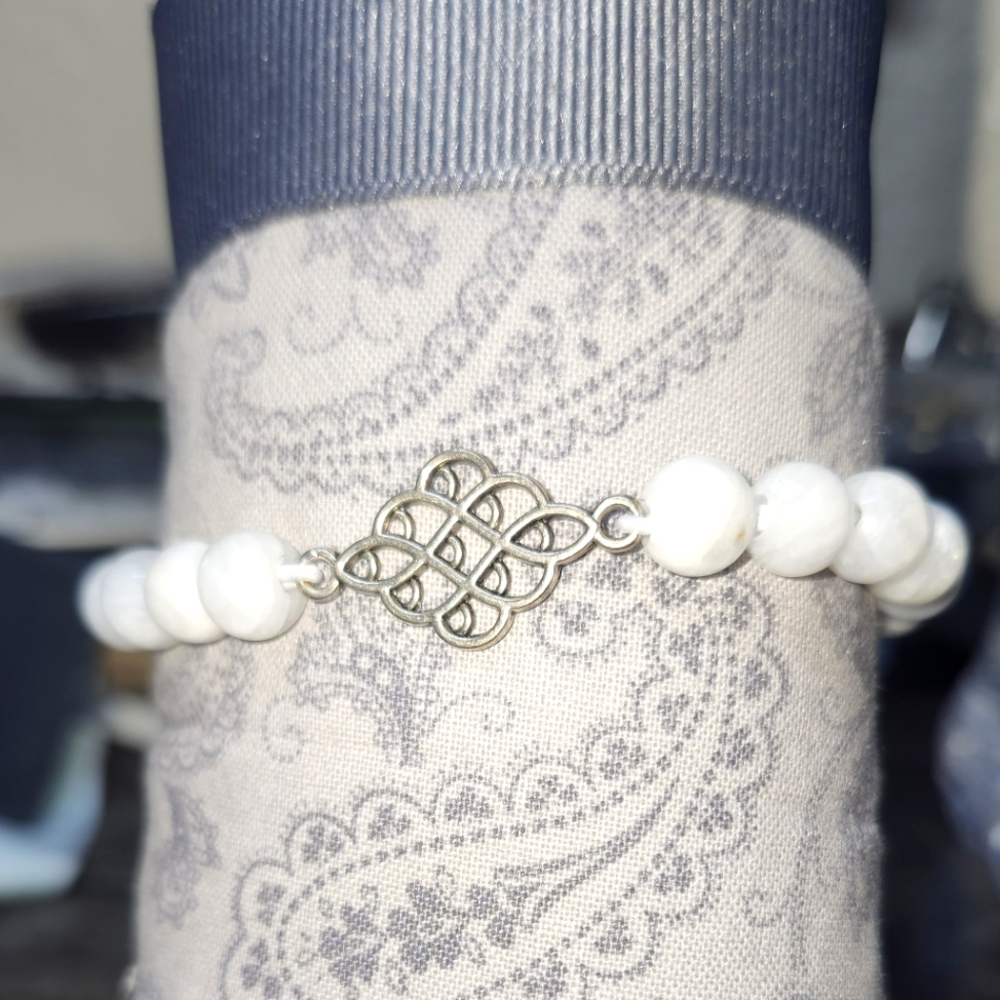 Moonstone handmade elastic bracelet with metal accent.